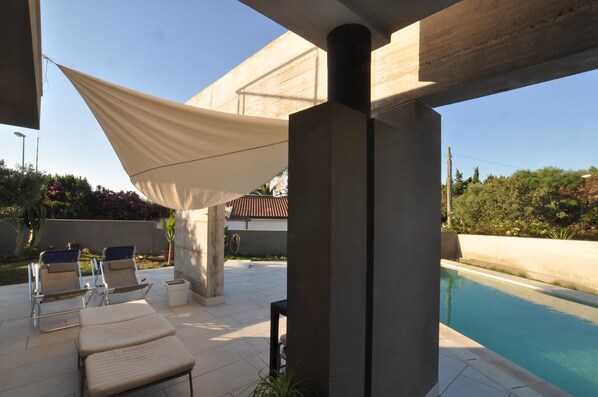Outdoor pool, an infinity pool, sun loungers