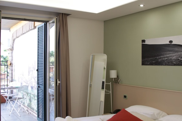 Double or Twin Room | Minibar, in-room safe, desk, rollaway beds