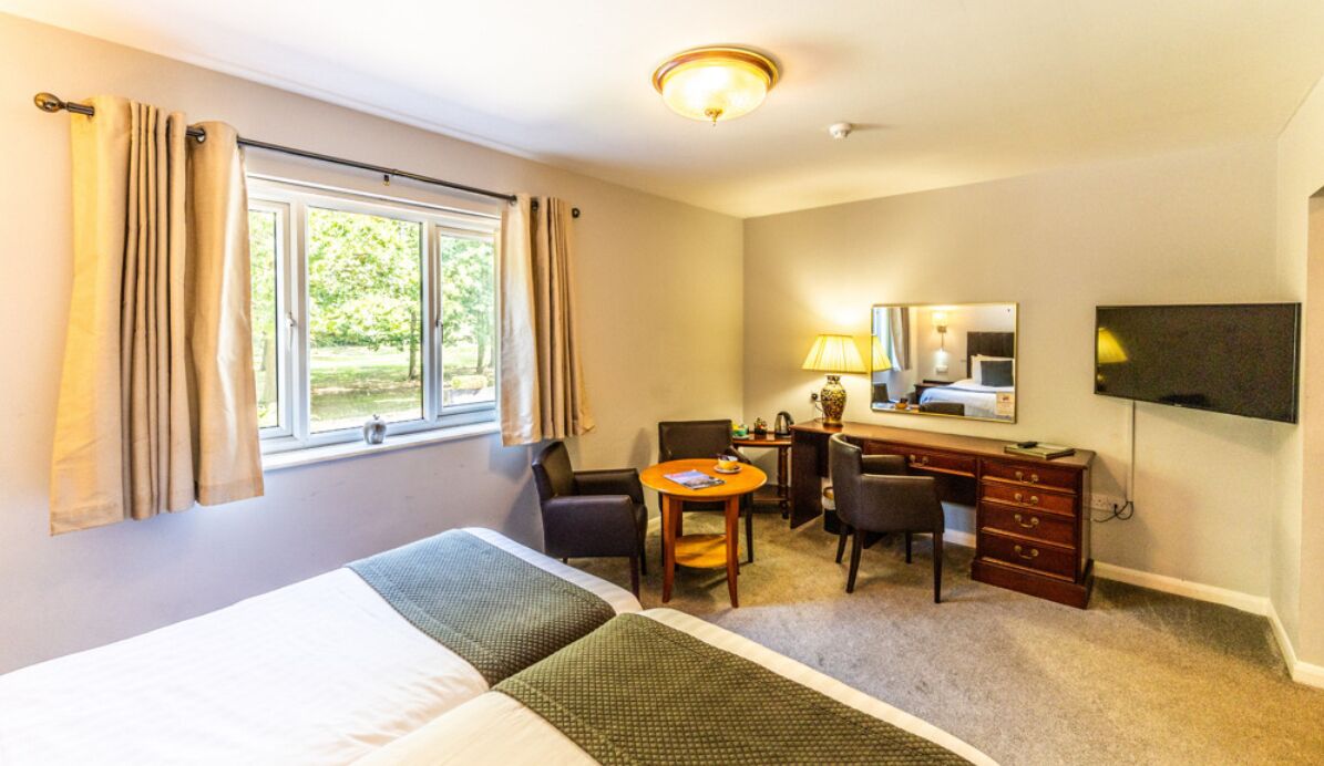 twin room, garden view | desk, laptop workspace, iron/ironing board, free wifi
