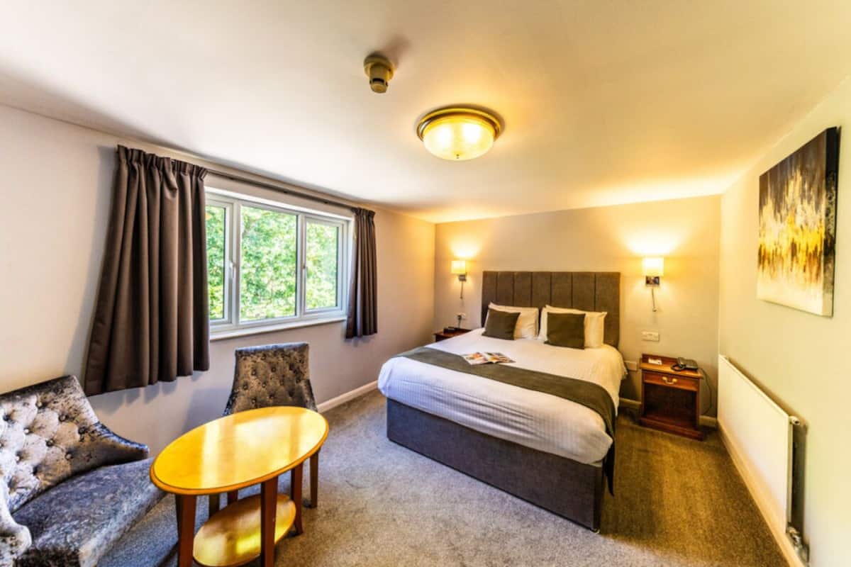 deluxe room, 1 king bed, garden view | desk, laptop workspace, iron/ironing board, free wifi