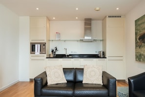 Executive Apartment, 1 Bedroom | Living area | Flat-screen TV