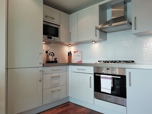 Executive Apartment, 1 Bedroom | Private kitchen | Full-size fridge, microwave, oven, stovetop