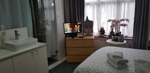 Blackout curtains, iron/ironing board, free WiFi, bed sheets