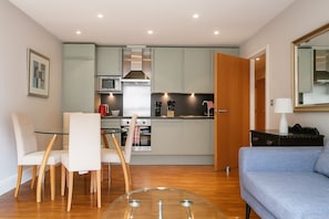 Executive Apartment, 1 Bedroom | Living area | Flat-screen TV