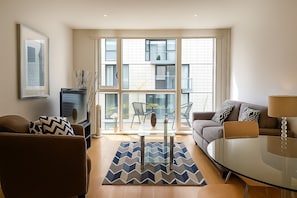 Deluxe Apartment, 1 Bedroom | Living area | Flat-screen TV