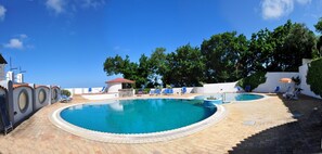 Seasonal outdoor pool, open 8:30 AM to 7:30 PM, pool umbrellas