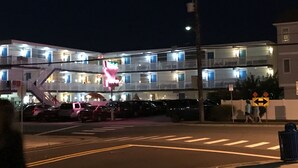 A multi-story motel with balconies and a neon sign. - Bird Of Paradise Motel (North Wildwood)