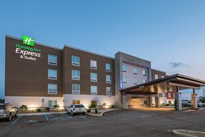 A Holiday Inn Express & Suites building with a modern design, featuring a flat roof, multiple windows, and a covered entrance area. - Holiday Inn Express & Suites - South Bend Casino  by IHG (South Bend)