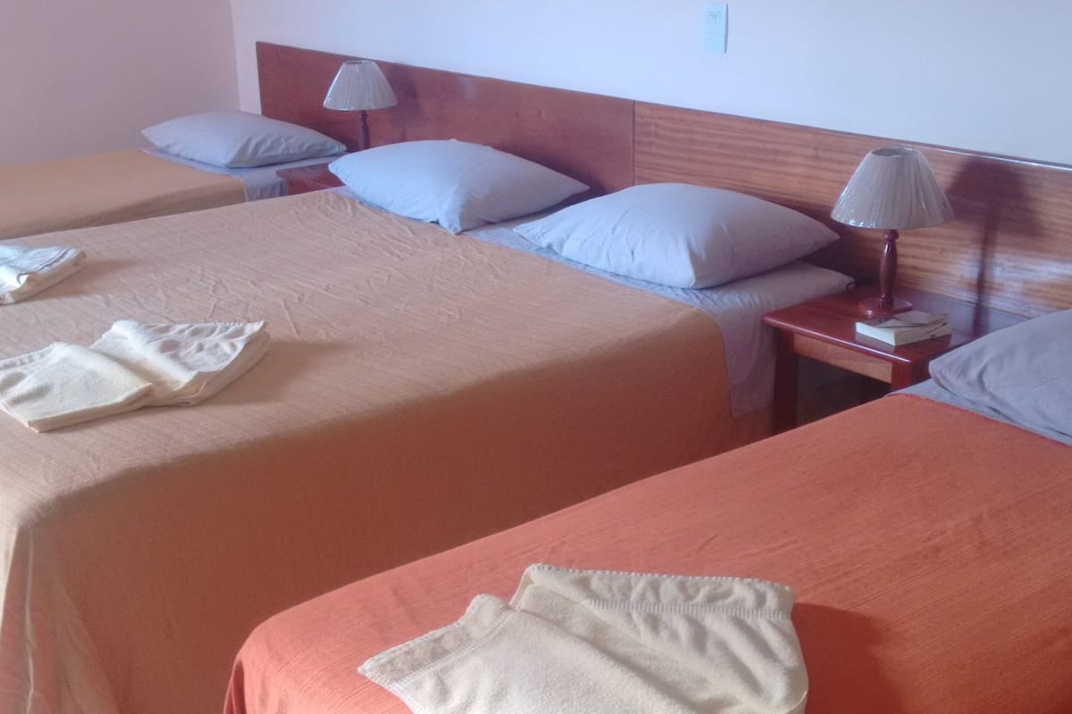 family quadruple room | minibar, in-room safe, desk, blackout curtains