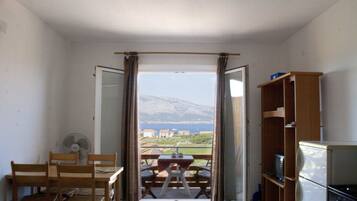 Panoramic Apartment, 1 Bedroom, Kitchen, Sea View | Living area | LCD TV