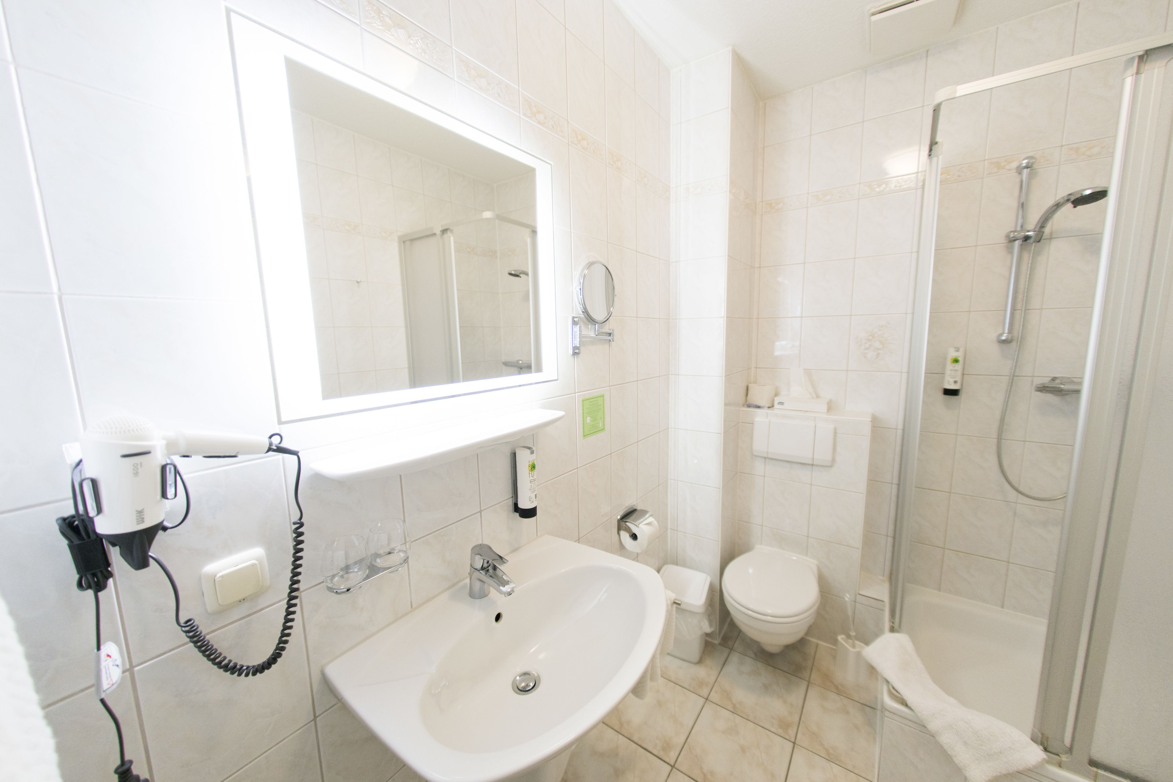 shower, free toiletries, hair dryer, towels