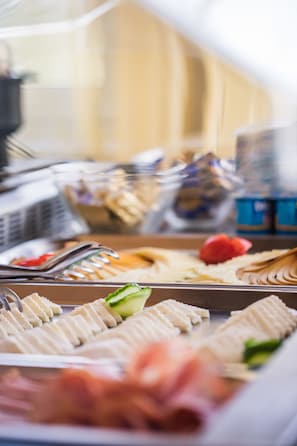 A buffet with various food items including meats, cheeses, and vegetables. - Hotel Europa Kokeltal (Albesti)