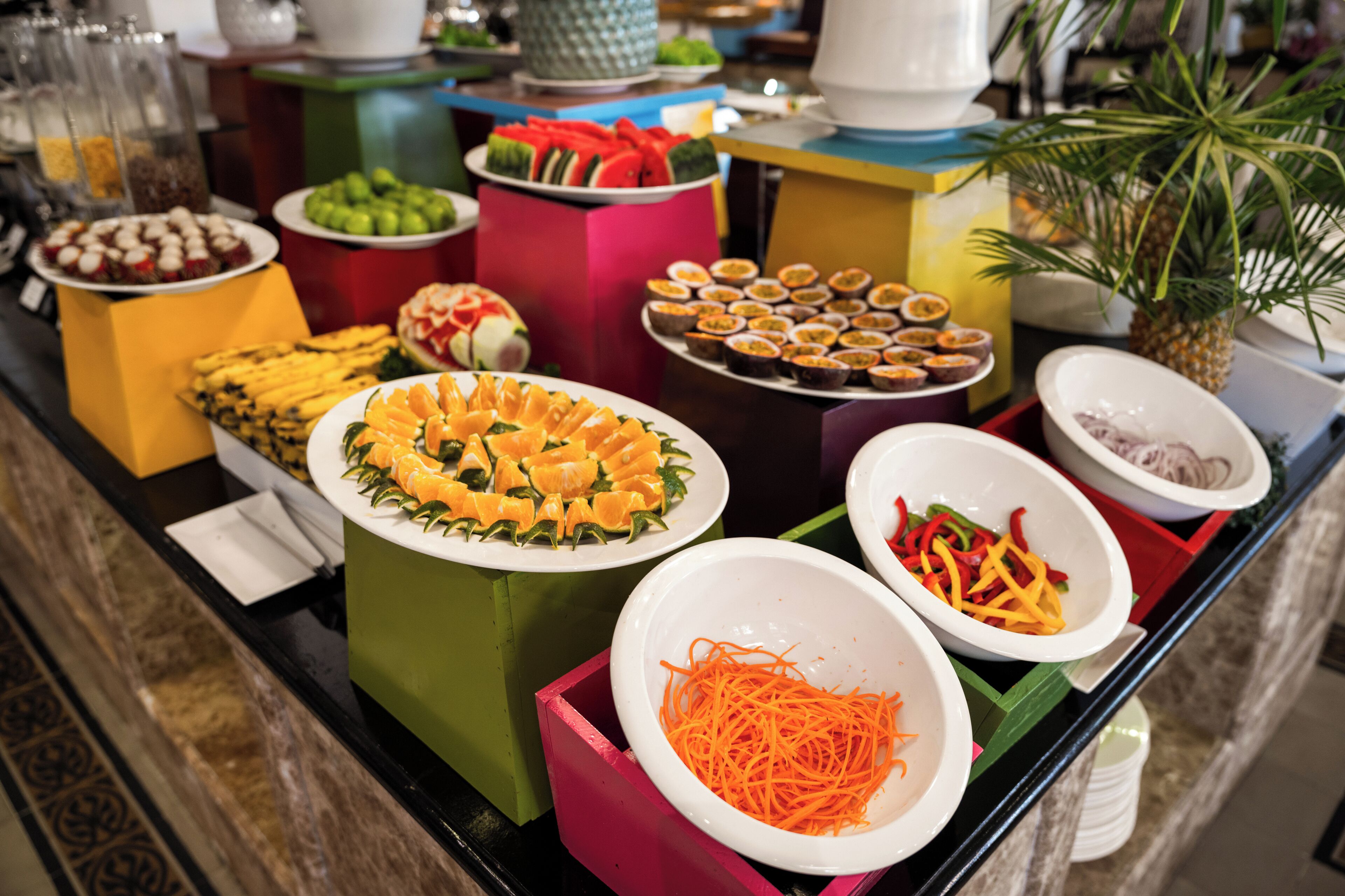 A buffet with various food items and containers.