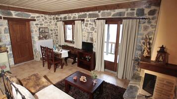 Suite, Fireplace, Mountain View | Living area | Flat-screen TV, fireplace