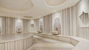 Experience refined luxury in this elegantly designed space, featuring a curved countertop and intricate patterned walls.