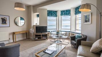 Superior Apartment, Kitchen, Sea View | Living area | Flat-screen TV, DVD player