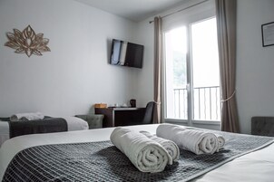 Triple Room | Desk, soundproofing, iron/ironing board (on request), cribs (free)