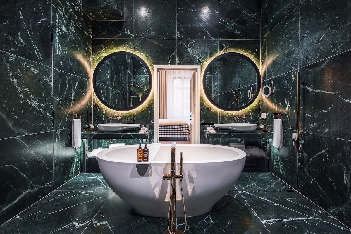 suite (pacai) | bathroom | designer toiletries, hair dryer, slippers, towels