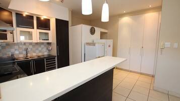 Apartment | Private kitchen | Full-size fridge, microwave, oven, stovetop
