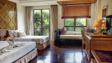 Family Room - Garden | Minibar, in-room safe, desk, blackout drapes