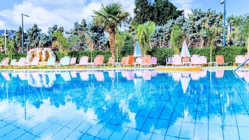Seasonal outdoor pool, open 9:00 AM to 8:00 PM, pool umbrellas
