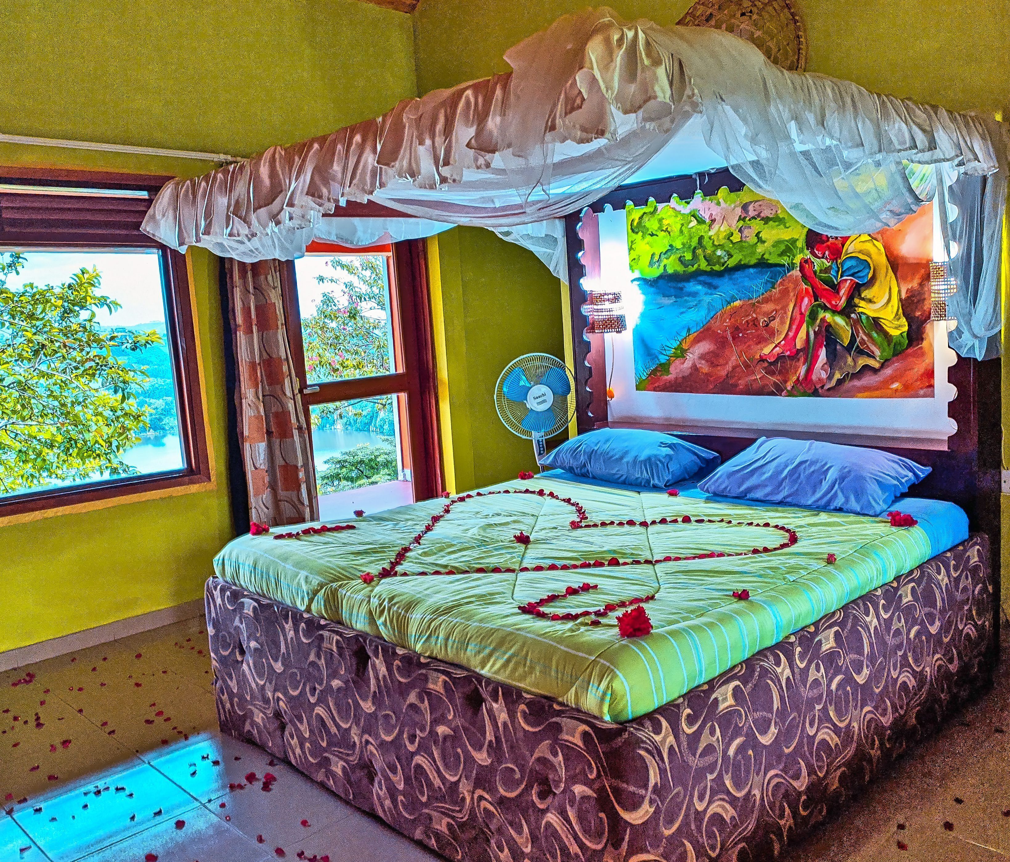 Laptop workspace, bed sheets