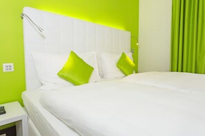 Premium bedding, down duvets, in-room safe, desk