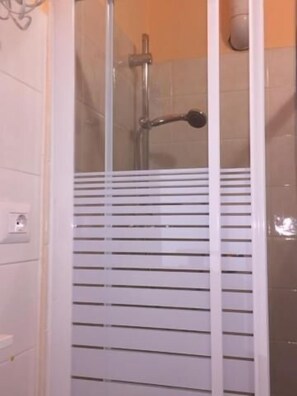 Shower, free toiletries, hair dryer, towels