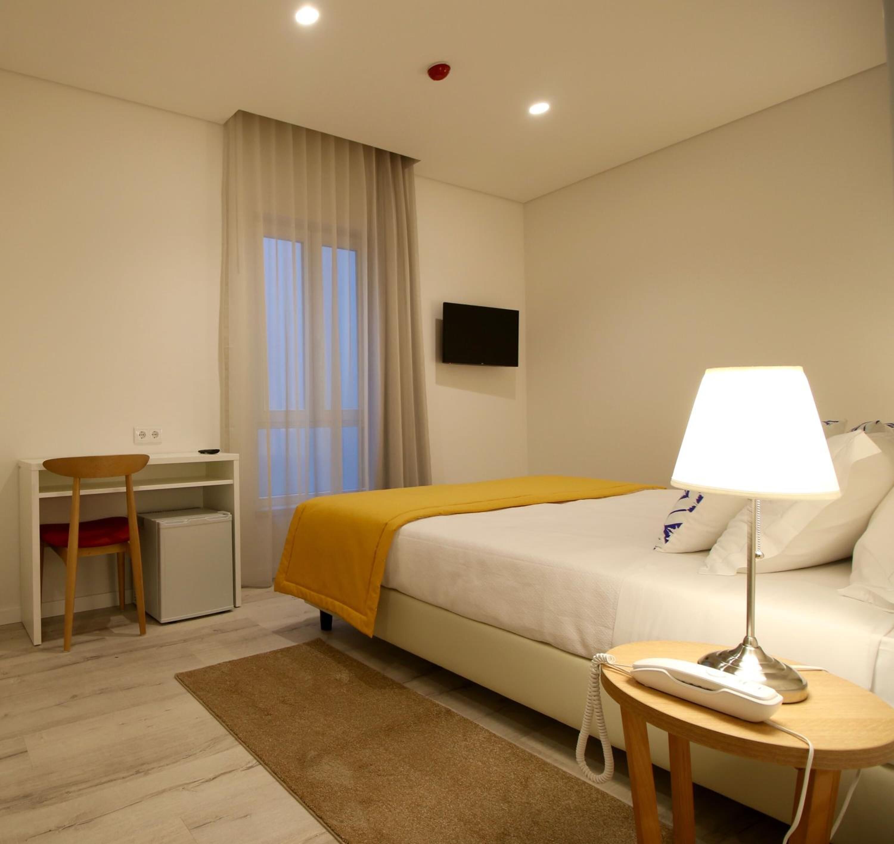 standard double or twin room | minibar, in-room safe, desk, laptop workspace