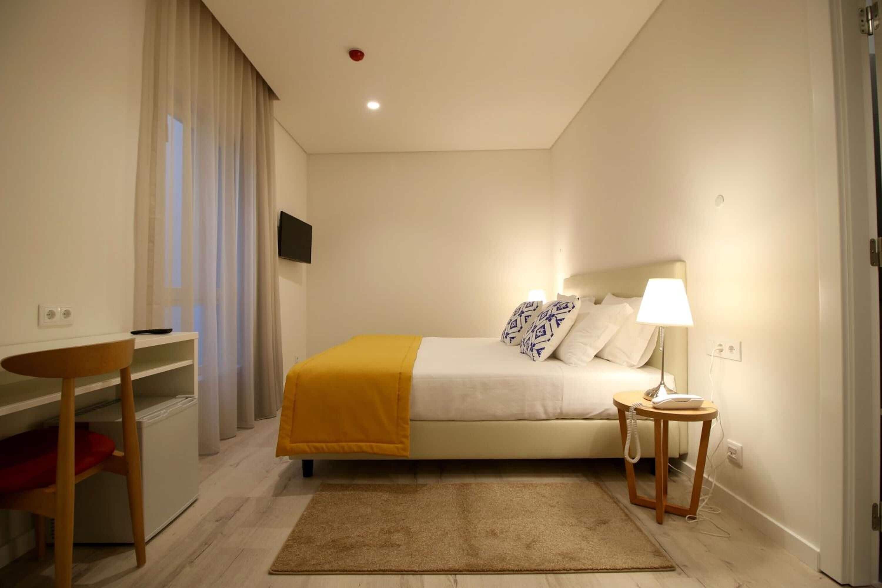 standard double or twin room | minibar, in-room safe, desk, laptop workspace