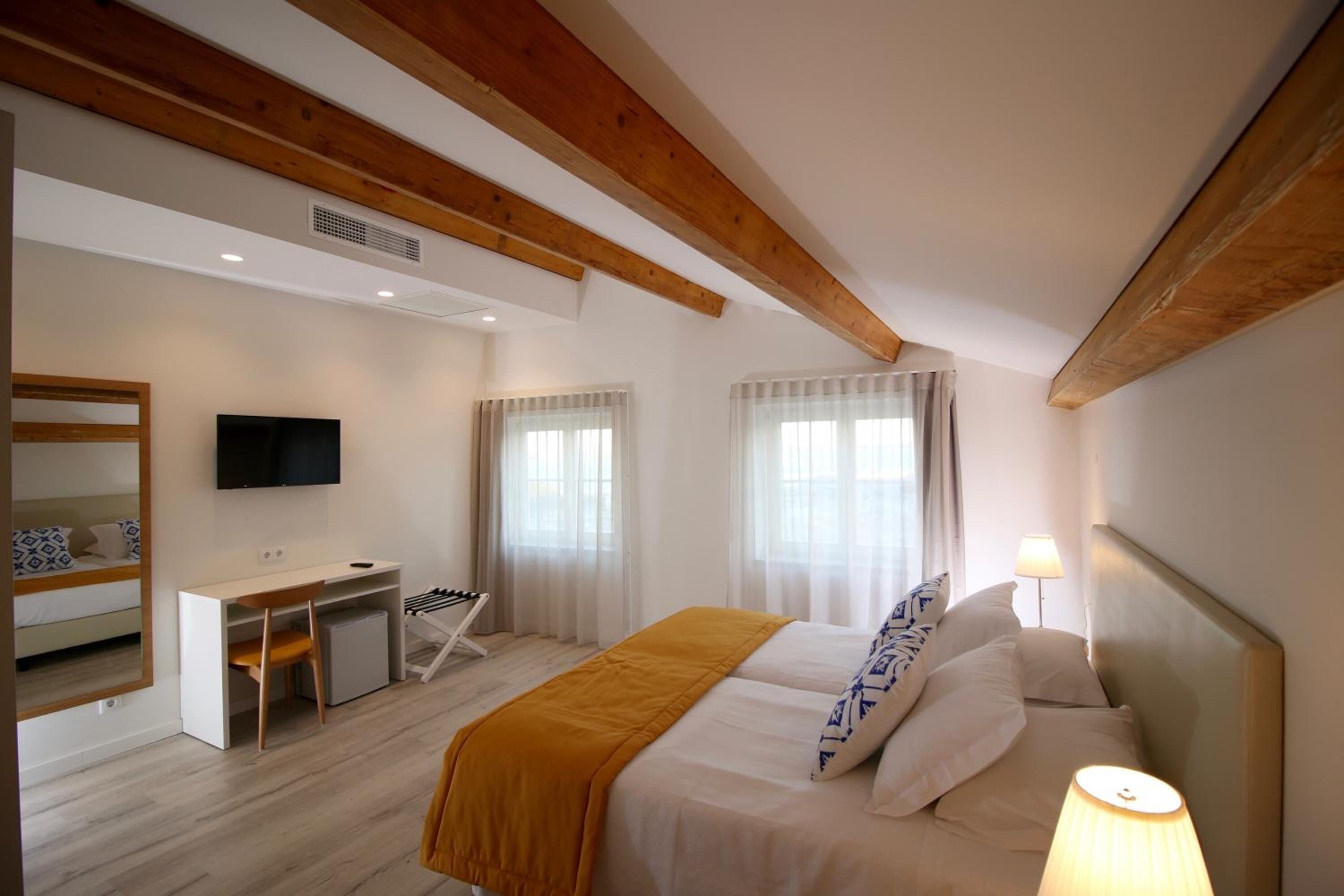 superior double or twin room | minibar, in-room safe, desk, laptop workspace