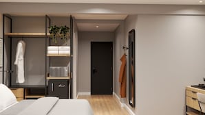 Una habitación de hotel moderna con una cama, un armario, un escritorio y una puerta que da a otra habitación.