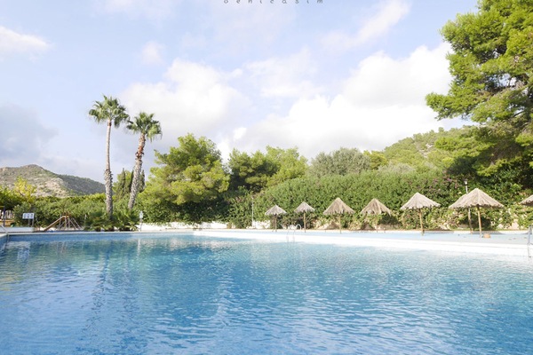 Outdoor pool, open 11:00 AM to 8:00 PM, pool umbrellas
