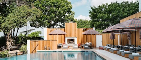 Outdoor pool, a heated pool, open 6:00 AM to 10:00 PM, pool umbrellas