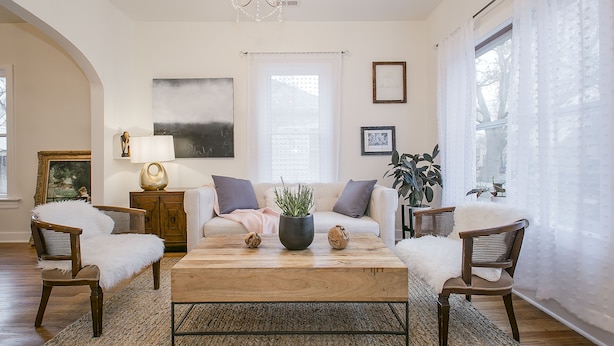 A living room with a wooden coffee table, white sofas, and a chandelier. - Simple Elegant Idaho Cottage (Boise)
