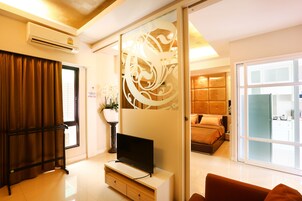 Premier Room | Desk, blackout drapes, iron/ironing board, rollaway beds