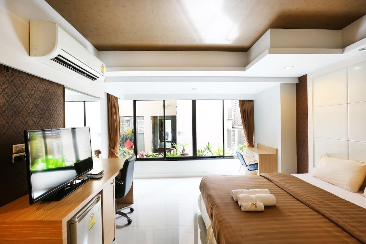 Family Room | Desk, blackout curtains, iron/ironing board, rollaway beds