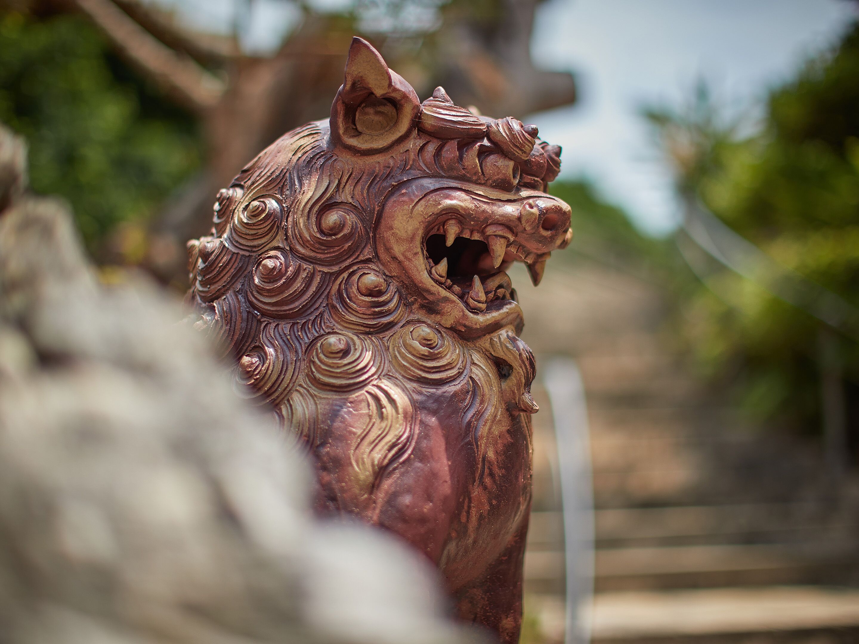 A detailed sculpture of a mythical creature with intricate carvings.