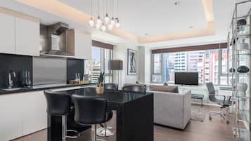 Suite, 1 Bedroom | Living area | LED TV, table tennis