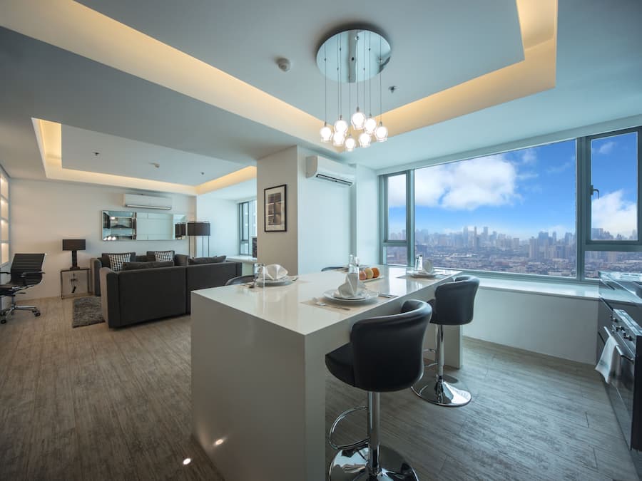 Deluxe Suite, 2 Bedrooms | Private kitchen | Full-sized fridge, microwave, oven, stovetop