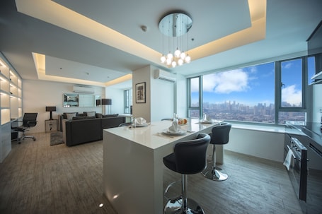 Deluxe Suite, 2 Bedrooms | Private kitchen | Full-size fridge, microwave, oven, stovetop