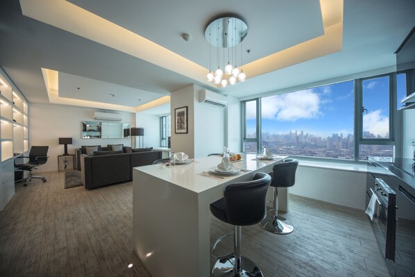Deluxe Suite, 2 Bedrooms | Private kitchen | Full-size fridge, microwave, oven, stovetop - The Alpha Suites (Makati)