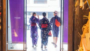 A doorway with a purple interior and a view of the street outside.