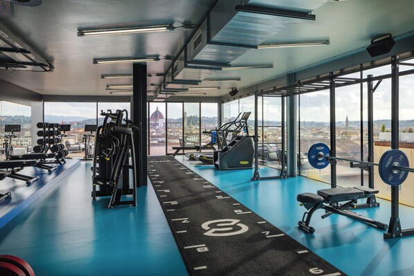 Work out with a city view at this gym featuring treadmills, weight machines, and free weights.