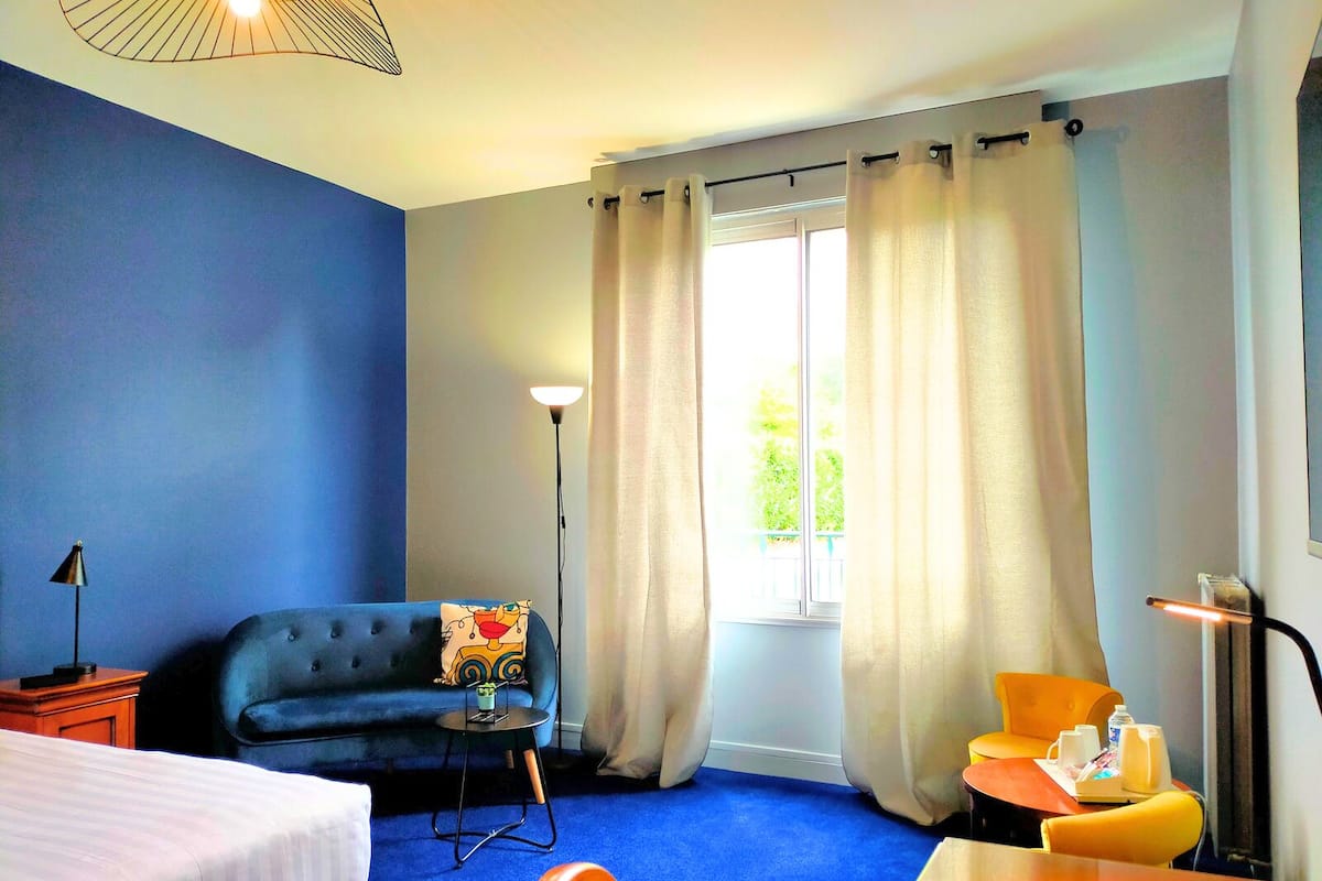 deluxe double room, 1 king bed, non smoking | individually decorated, desk, laptop workspace, blackout curtains