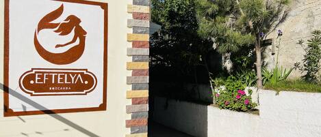 A building entrance with a sign reading "EFTELYNA BOZCAADA".