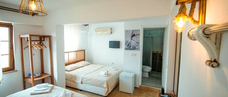 Family Room, Partial Sea View | Minibar, free WiFi, bed sheets