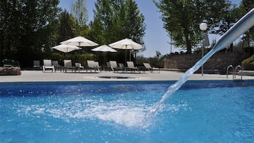 Seasonal outdoor pool, pool umbrellas, pool loungers