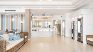 A spacious lobby with a reception desk, a staircase, and a kitchenette area. - Hotel Amalfi riccione (Riccione)