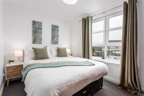 Premium bedding, iron/ironing board, travel crib, free WiFi